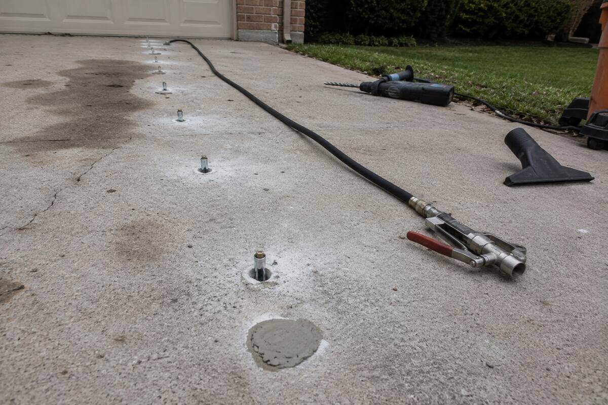 Injection ports set into a slab for foam lifting